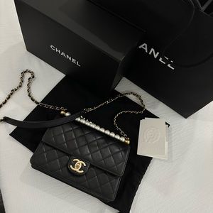 CHANEL quilted pearl flap bag in black lambskin